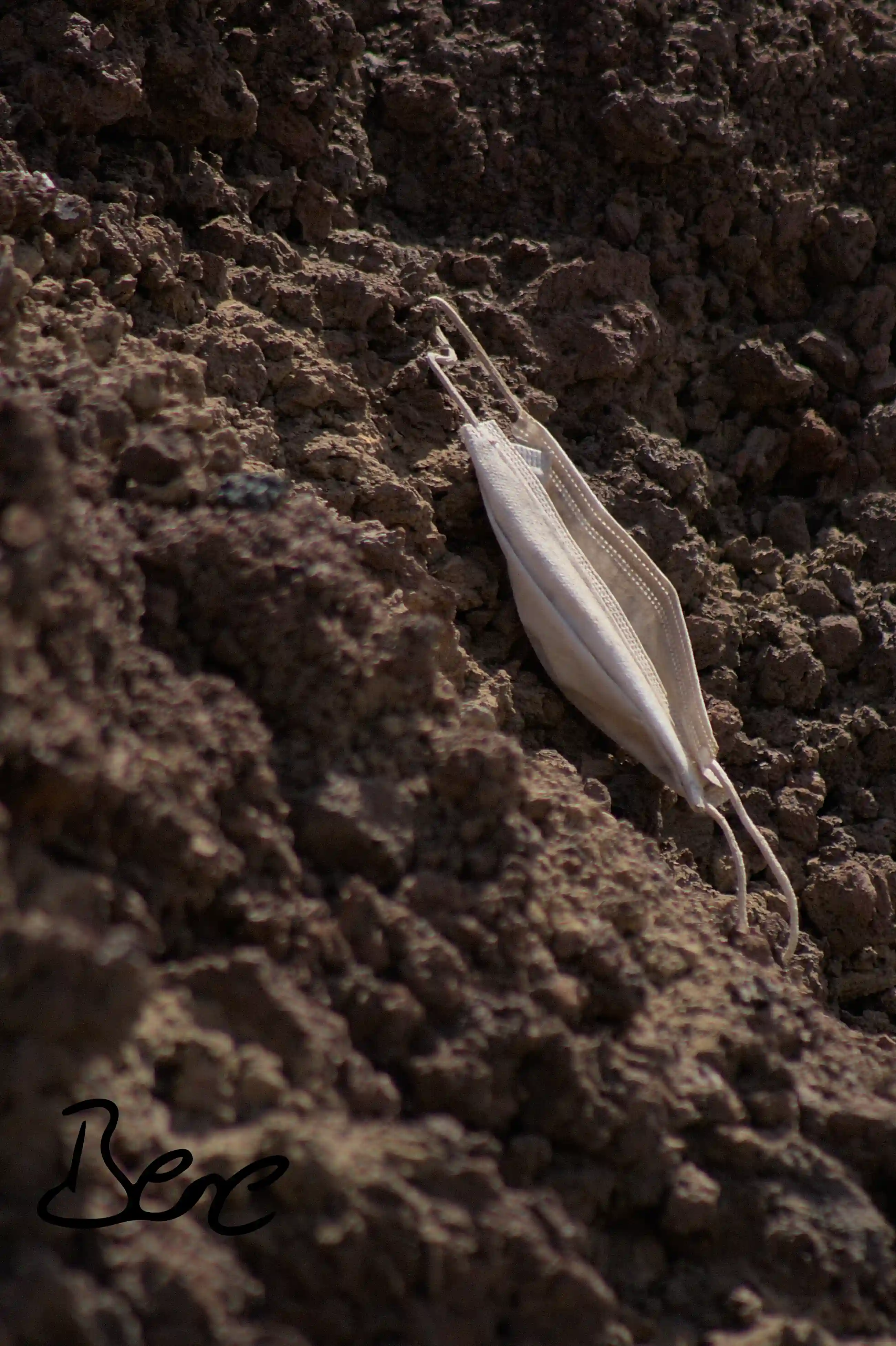 Mask hanging at a stone